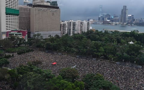 Protesters gather for a rally in Victoria Park in Hong Kong on Sunday - Credit: AFP