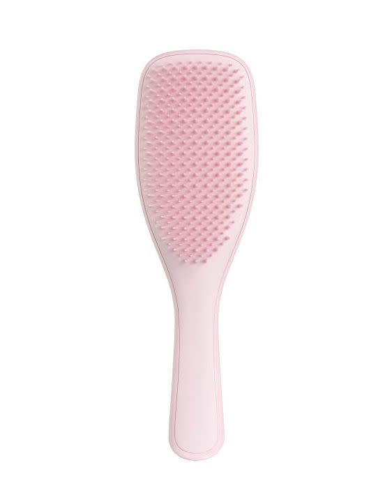 <p><a rel="nofollow noopener" href="https://www.lookfantastic.com/tangle-teezer-the-wet-detangler-hair-brush-millennial-pink/11669535.html?" target="_blank" data-ylk="slk:BUY;elm:context_link;itc:0;sec:content-canvas" class="link ">BUY</a></p><p>Second only to finger detangling, this gentle but effective brush is great when used on wet hair. While using your favourite co-wash, just pass the brush through your hair and feel as the 325 unique teeth flex over tangles and knots. <br></p>