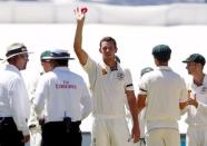 Australia's Josh Hazlewood (C) holds the ball as he celebrates taking his fifth wicket for the innings after dismissing New Zealand's Mark Craig for 15 runs during the third day of their third cricket test match at the Adelaide Oval, in South Australia, November 29, 2015. REUTERS/David Gray