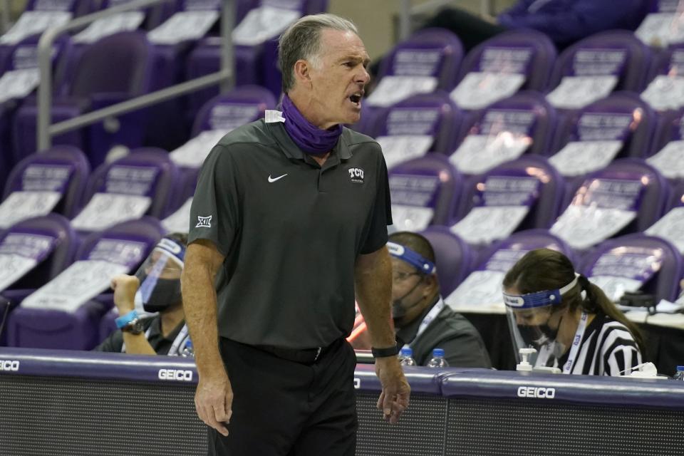 TCU head coach Jamie Dixon instructs the bench in the second half of an NCAA college basketball game against Oklahoma in Fort Worth, Texas, Sunday, Dec. 6, 2020. (AP Photo/Tony Gutierrez)