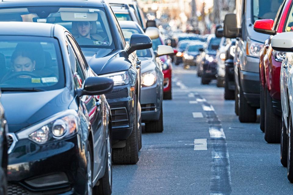 Bumper to bumper traffic is featured on Main Street on a sunny and warm winter day In Newark, Thursday, Feb. 23, 2023.