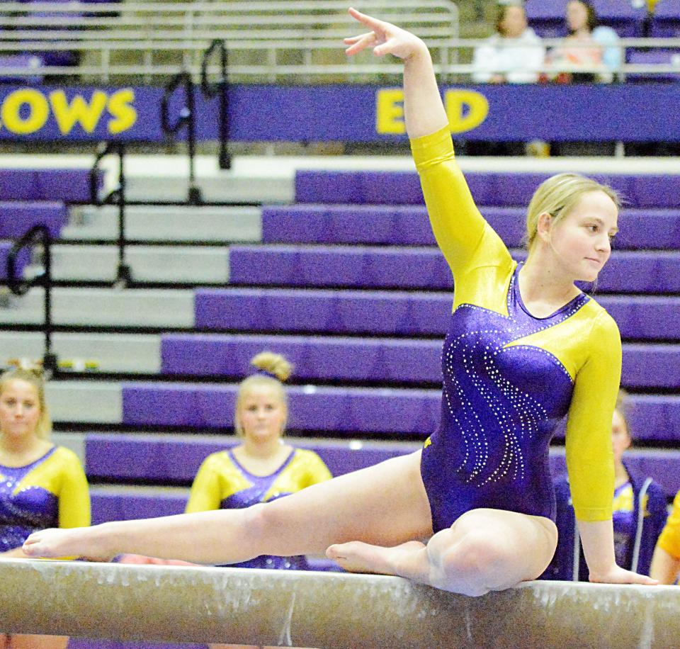 Watertown's Dawson Briggs performs on the balance beam during a high school gymnastics triangular Tuesday in the Civic Arena. The Arrows finished second in the meet behind Sioux Falls O'Gorman.