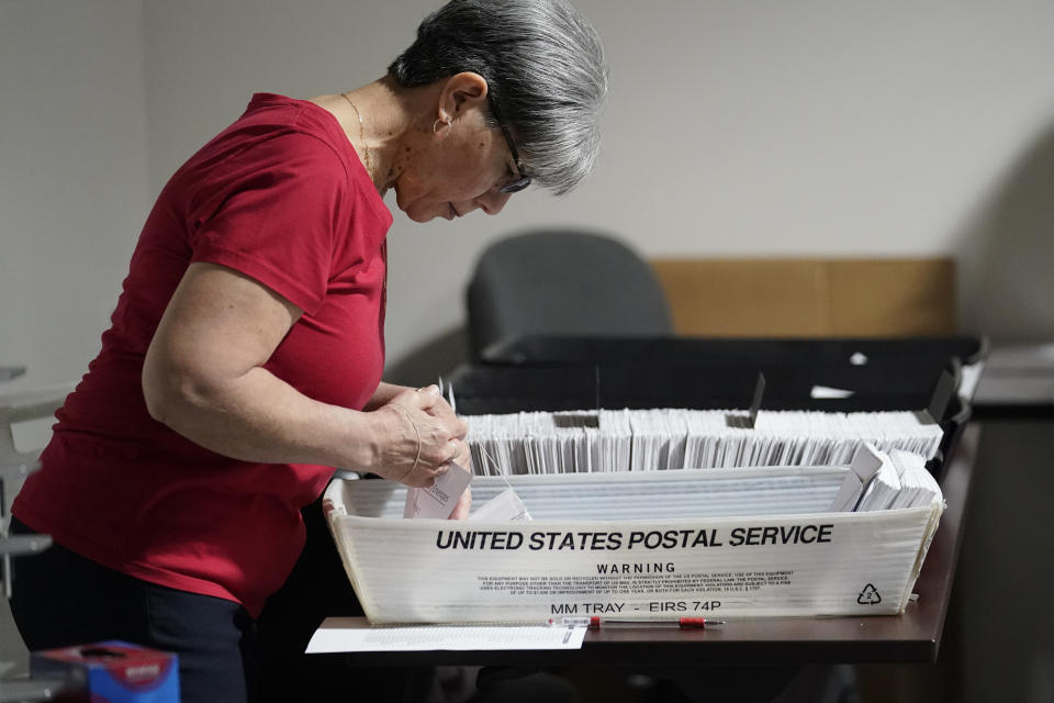 An election worker continues the process in counting ballots for the Pennsylvania primary election, Wednesday, May 18, 2022, at the Mercer County Elections Board in Mercer, Pa. Vote counting continues as Republican candidates Dr. Mehmet Oz and David McCormick are locked in a too-early-to-call race for Pennsylvania's hotly contested Republican nomination for an open U.S. Senate seat. (AP Photo/Keith Srakocic)