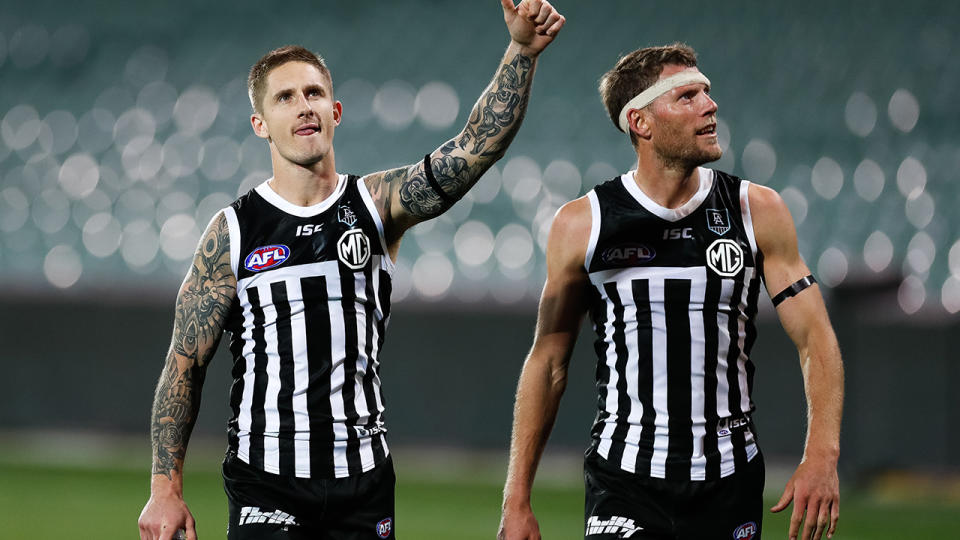 Hamish Hartlett and Brad Ebert, pictured here wearing Port Adelaide's Prison Bar guernsey.