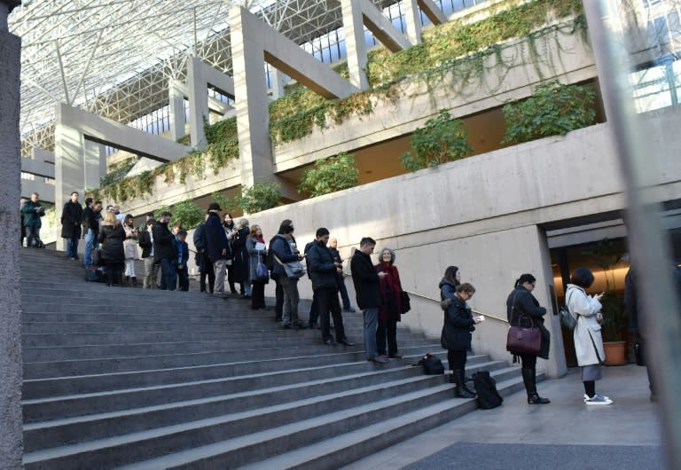 Journalists and members of the public line up outside the British Columbia Supreme Court where Meng Wanzhou's case is being heard in Canada