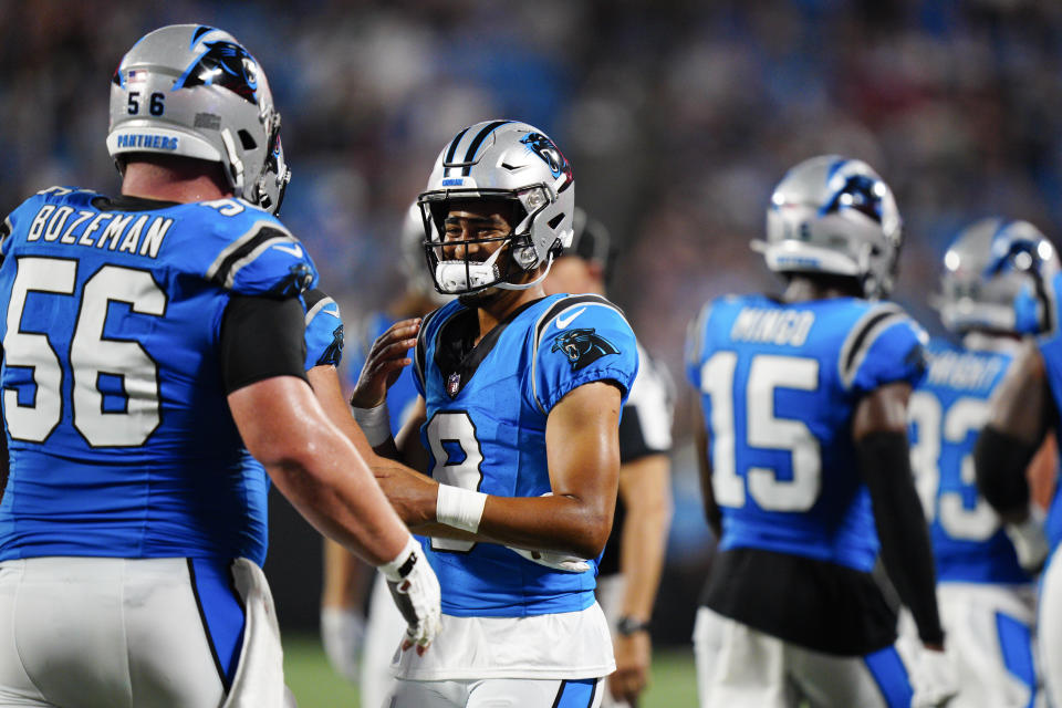 Carolina Panthers quarterback Bryce Young celebrates after throwing a touchdown pass with center Bradley Bozeman against the Detroit Lionsduring the first half of a preseason NFL football game Friday, Aug. 25, 2023, in Charlotte, N.C. (AP Photo/Jacob Kupferman)