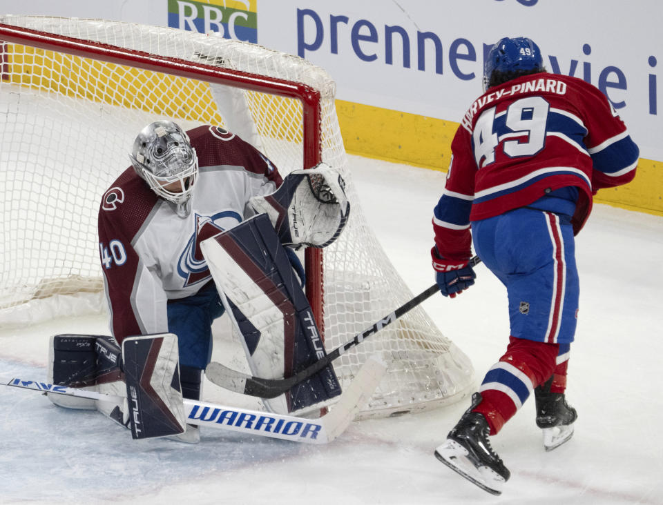 Montreal Canadiens left wing Rafael Harvey-Pinard (49) scores on Colorado Avalanche goaltender Alexandar Georgiev (40) during the second period of an NHL hockey game Monday, Jan. 15, 2024, in Montreal. (Ryan Remiorz/The Canadian Press via AP)