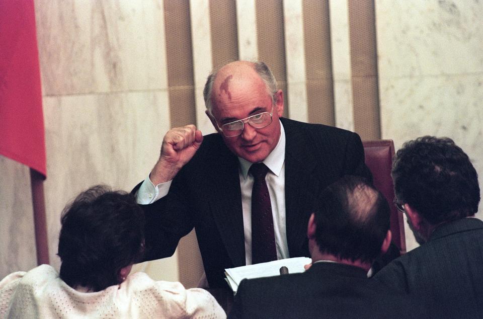 Soviet President Mikhail Gorbachev raises a clenched fist as he makes a point on the second day of the extraordinary session of the Supreme Soviet in Moscow on August 27, 1991. Gorbachev threatened to resign if the republics refused to sign a Union Treaty to hold the Soviet Union together.