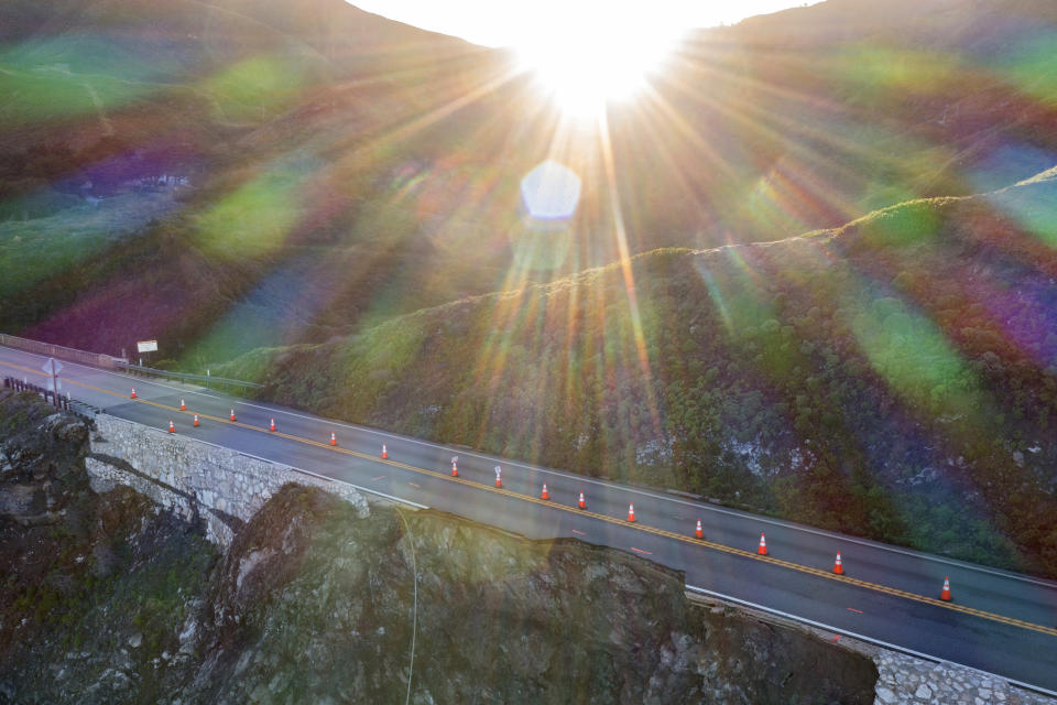 Cones mark a break in the southbound lane of Highway 1 at Rocky Creek Bridge in Big Sur, Calif., Monday, April 1, 2024, following an Easter weekend storm. (AP Photo/Nic Coury)