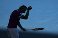 Rafael Nadal of Spain prepares to serve to Denis Shapovalov of Canada during their quarterfinal match at the Australian Open tennis championships in Melbourne, Australia, Tuesday, Jan. 25, 2022. (AP Photo/Simon Baker)