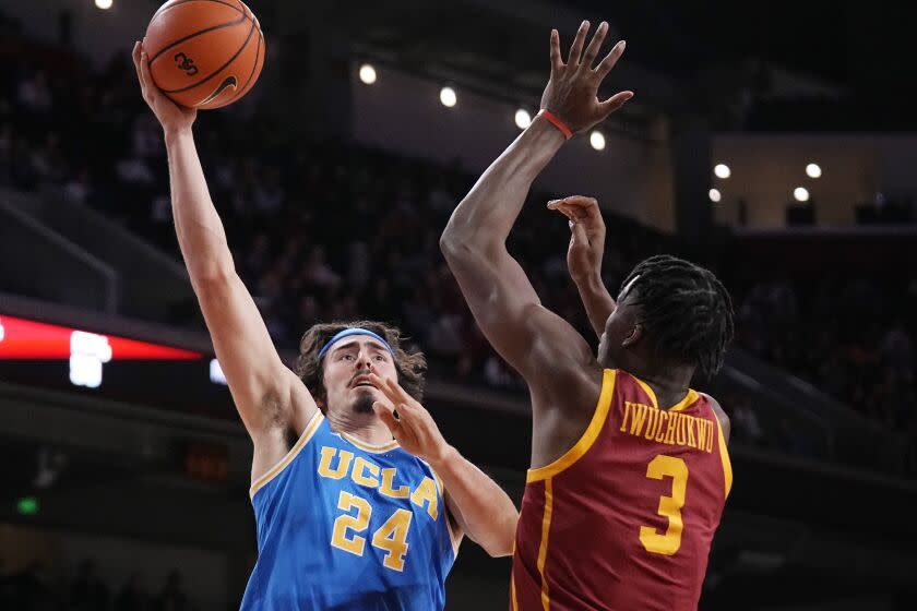 UCLA guard Jaime Jaquez Jr. shoots over USC forward Vincent Iwuchukwu