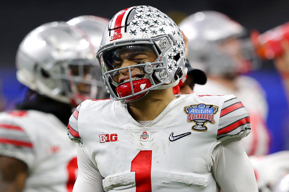 Ohio State's Justin Fields reacts after a hit against Clemson in the first half of the College Football Playoff semifinal game on Jan. 1. (Kevin C. Cox/Getty Images)