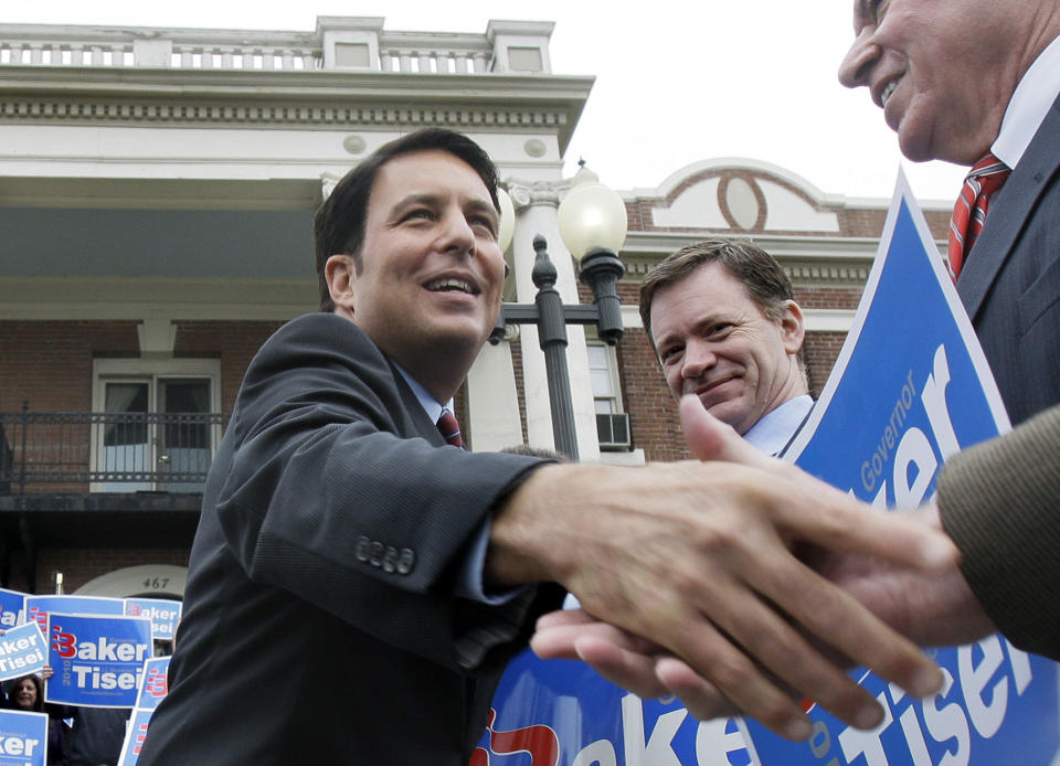 FILE - In this Nov. 23, 2009 file photo, Massachusetts State Sen. Richard Tisei shakes hands with supporters in Wakefield, Mass. The GOP’s formal platform, as set in its 2012 national convention, declares that “marriage, the union of one man and one woman, must be upheld as the national standard.” Republican opposition to gay marriage has become less visible recently, however, as the GOP works to improve its image and polling suggests that most Americans support same-sex marriage. Tisei, who is married to a man, is expected to run again for the northeastern Massachusetts congressional seat he narrowly lost in 2012 to Democratic Rep. John Tierney. (AP Photo/Elise Amendola, File)