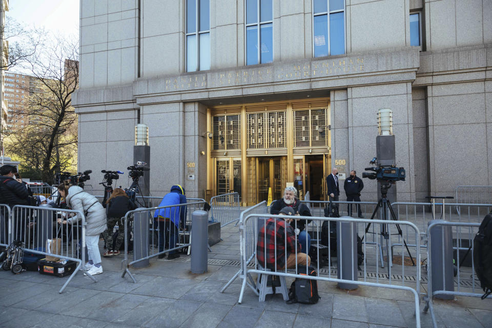 Members of the press congregate during Ghislaine Maxwell's appearance in Federal Court on Friday, April 23, 2021, in New York. Ghislaine Maxwell, a British socialite and one-time girlfriend of Epstein, pleaded not guilty to sex trafficking conspiracy and an additional sex trafficking charge that were added in a rewritten indictment released last month by a Manhattan federal court grand jury. (AP Photo/Kevin Hagen)