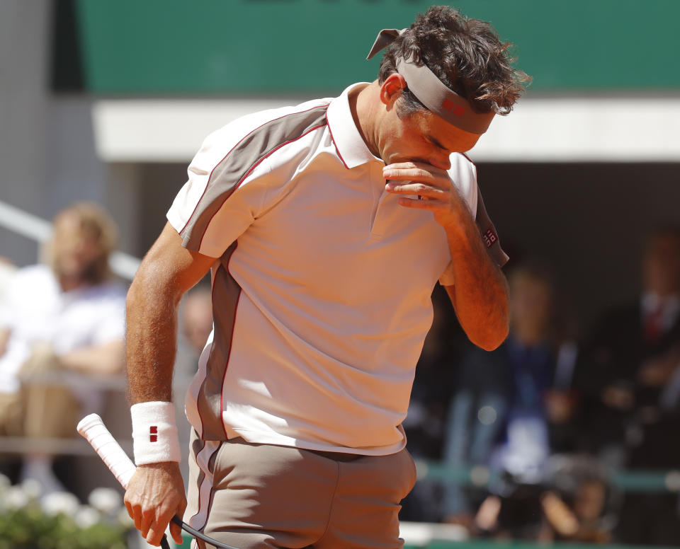 Switzerland's Roger Federer reacts after missing a shot against Spain's Rafael Nadal during their semifinal match of the French Open tennis tournament at the Roland Garros stadium in Paris, Friday, June 7, 2019. (AP Photo/Michel Euler)