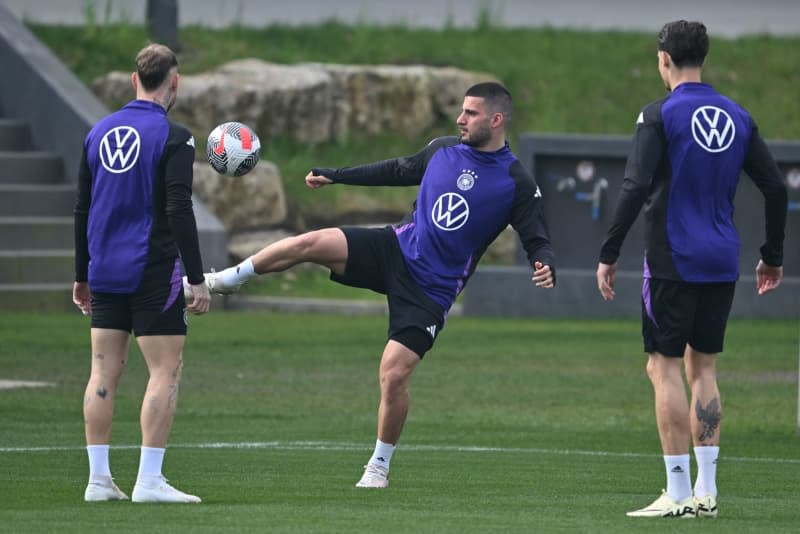 (L-R) German national team players David Raum, Deniz Undav and Robin Koch take part in a training session at DFB Campus ahead of the friendly matches against France. Arne Dedert/dpa