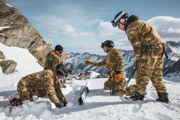 <span class="article__caption">This is not a snack break, boys. The Bravo Team practices a T-trench lower, utilizing their skis as a snow anchor. </span> (Photo: Max Archambault)