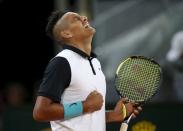 Nick Kyrgios of Australia celebrates his victory over Roger Federer of Switzerland at the end of their match at the Madrid Open tennis tournament in Madrid, Spain, May 6, 2015. REUTERS/Susana Vera