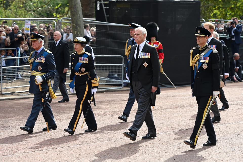 King Charles III, Princess Anne, Princess Royal, Prince Andrew, Duke of York and Prince Edward, Earl of Wessex walk behind the coffin during the procession for the Lying-in State of Queen Elizabeth II on September 14, 2022 in London, England.