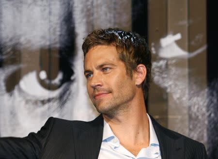 U.S. actor Paul Walker smiles during the premiere of the movie "Fast and Furious 4" in Taipei April 15, 2009. REUTERS/Nicky Loh