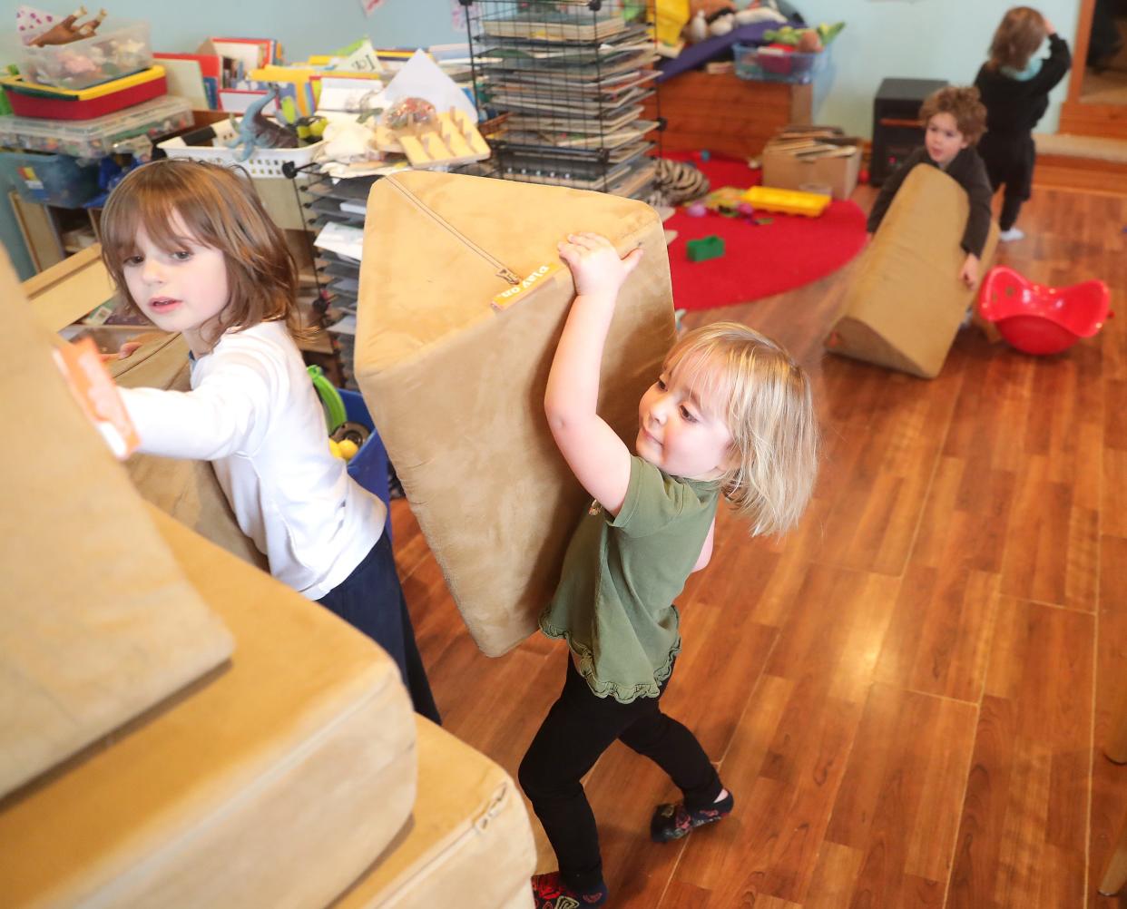 Kai Wells, left, 5, and Quinn Wells, 3, help pick up before going outside to play at Corrine's Little Explorers on Jan. 25 in New Glarus. The home-based family child care center is owned by Corrine Hendrickson. The children's mother, Diana Rogers Wells, explained that she chose not to enroll Kai in public 4K this year and instead opted to keep him enrolled at Corrine's Little Explorers for a variety of reasons. If a Republican bill that would change public 4K in Wisconsin becomes law, families like Rogers Wells' would be able to keep their children enrolled in their trusted child care environment and still get free 4K instruction.