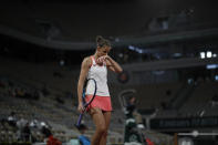 Karolina Pliskova of the Czech Republic reacts after missing a shot against Latvia's Jelena Ostapenko in the second round match of the French Open tennis tournament at the Roland Garros stadium in Paris, France, Thursday, Oct. 1, 2020. (AP Photo/Alessandra Tarantino)