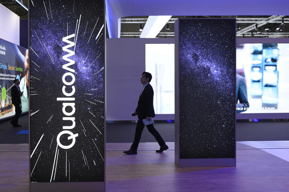A visitor walks past the stand of American multinational corporation Qualcomm at the Mobile World Congress (MWC), the telecom industry's biggest annual gathering, in Barcelona on March 2, 2023. (Photo by Josep LAGO / AFP) (Photo by JOSEP LAGO/AFP via Getty Images)