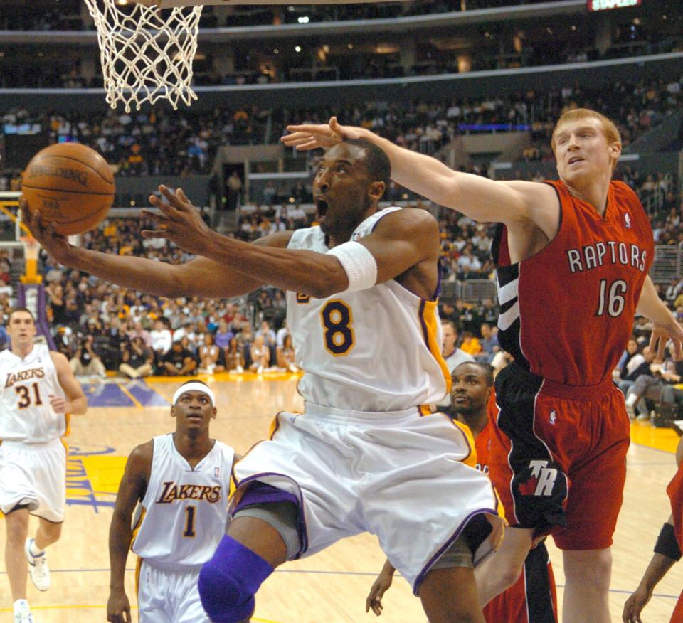 Kobe Bryant drives around Raptors forward Matt Bonner on his way to scoring 81 points, the second-highest single-game total in NBA history, on Jan. 22, 2006.