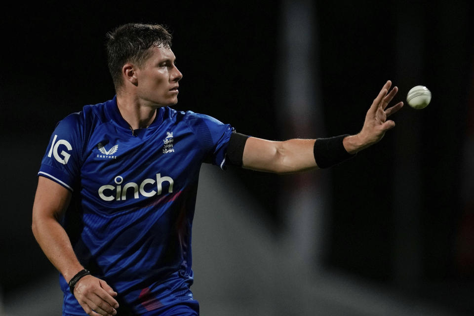 England's Matthew Potts receives the bal to bowl against West Indies during the third ODI cricket match at Kensington Oval in Bridgetown, Barbados, Saturday, Dec. 9, 2023. (AP Photo/Ricardo Mazalan)