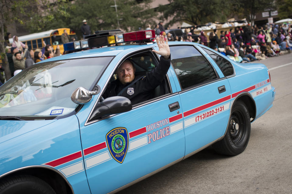This Nov. 21, 2020 shows Houston police officer Jason Knox in a restored HPD cruiser in Houston. The Houston police department tweeted that Knox, a Tactical Flight Officer, was killed when a police helicopter crashed early Saturday, May 2, 2020 in Houston. (Steve Gonzales/Houston Chronicle via AP)