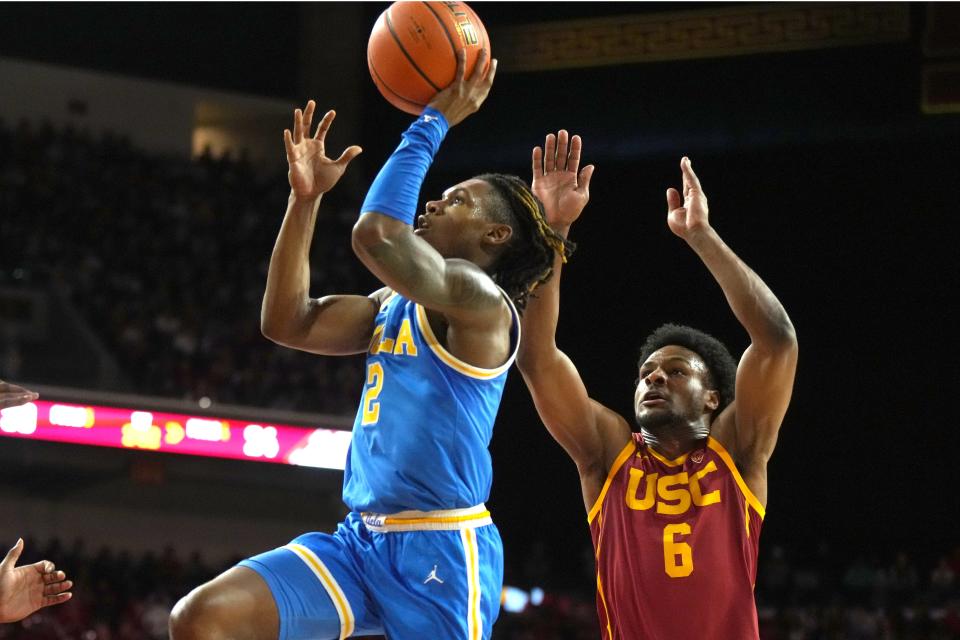 UCLA Bruins guard Dylan Andrews (2) shoots the ball against Southern California Trojans guard Bronny James (6) in the first half at Galen Center Jan. 27, 2024, in Los Angeles.