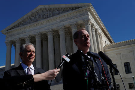 Microsoft President and Chief Legal Officer Brad Smith (R) makes a statement to the news media with his lawyer Josh Rosenkranz outside of the U.S. Supreme Court in Washington, U.S., February 27, 2018. REUTERS/Leah Millis