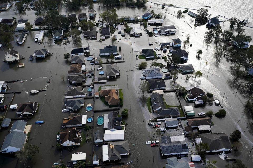 FILE - Homes are flooded in the aftermath of Hurricane Ida, Aug. 30, 2021, in Jean Lafitte, La. National Oceanic and Atmospheric Administration on Thursday, May 25, 2023, announced its forecast for the 2023 hurricane season. (AP Photo/David J. Phillip, File)