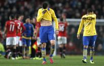 Arsenal's Laurent Koscielny reacts after their English Premier League soccer match against Manchester United at Old Trafford in Manchester, northern England, November 10, 2013.