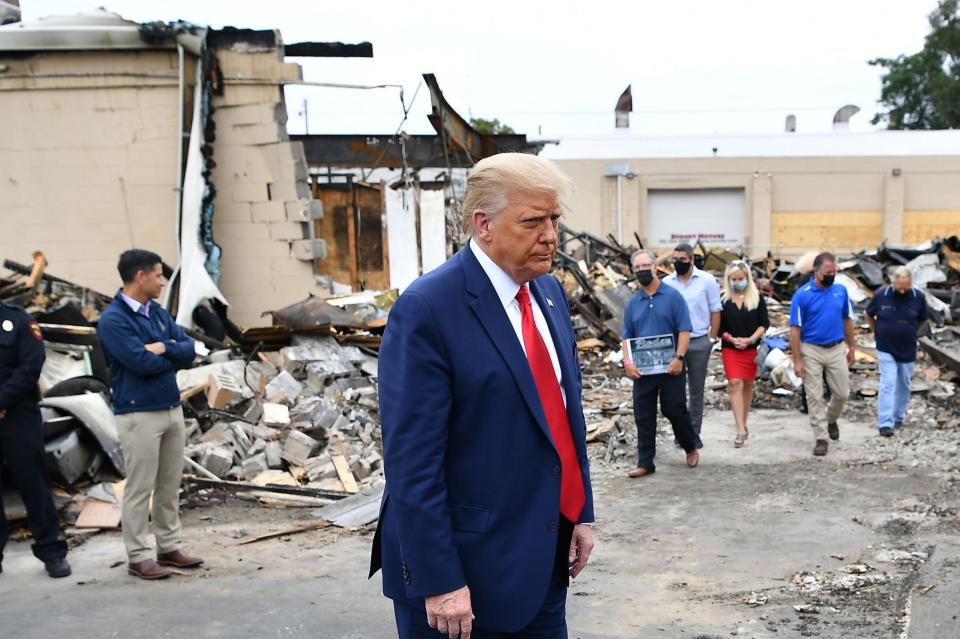 Donald Trump on tour in a post-riot area of Kenosha, Wisconsin: AFP via Getty Images