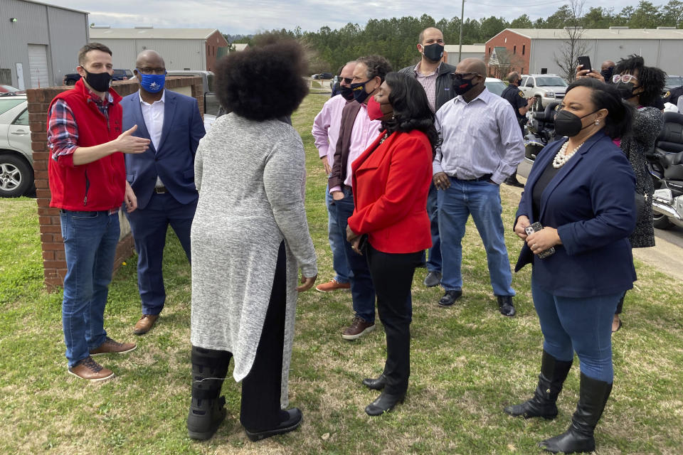 Rep. Terri Sewell, D-Ala, in the center wearing red, and Rep. Nikema Williams, D-Ga., at the far right, join fellow members of Congress, labor organizers and employees at an Amazon facility in Bessemer, Ala., on March 5, 2021. The nearly 6,000 workers at the plant are voting on whether to form a union. The election is the largest unionizing effort ever for Amazon, one of the world’s wealthiest firms, and would be a major victory for organized labor and its Democratic Party allies as the labor movement tries to reverse decades of declining membership nationally. (AP Photo/Bill Barrow)