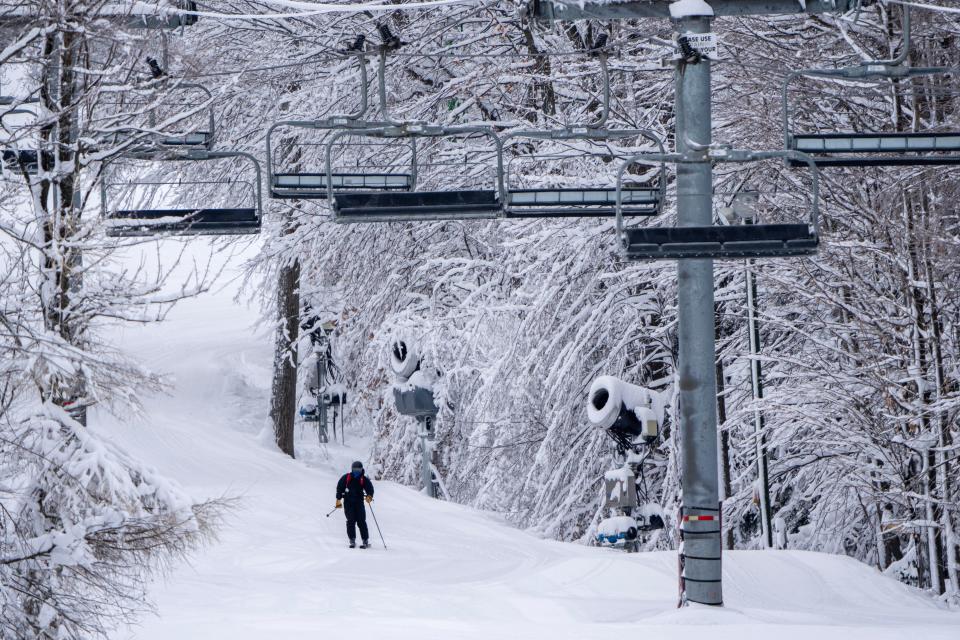 A skier makes his way to a quad lift on Dec. 21, 2022, at Granite Peak Ski Resort in Wausau. Granite Peak features the state's largest vertical drop at 700 feet.