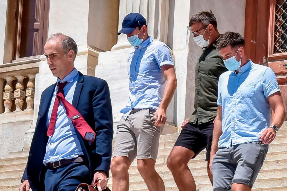 Harry Maguire (second left) leaves court in Syros (AFP via Getty Images)