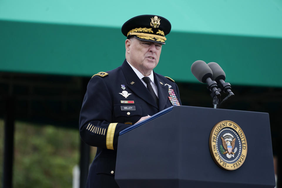 Retiring Chairman of the Joint Chiefs of Staff Gen. Mark Milley speaks during the Armed Forces Farewell Tribute in honor of Milley at Joint Base Myer-Henderson Hall, Friday, Sept. 29, 2023, in Fort Meyer, Va. Also held was an Armed Forces Hail in honor of Gen. CQ Brown, Jr., who the Senate confirmed as the next chairman of the Joint Chiefs of Staff. Defense Secretary Lloyd Austin applauds at left. (AP Photo/Manuel Balce Ceneta)