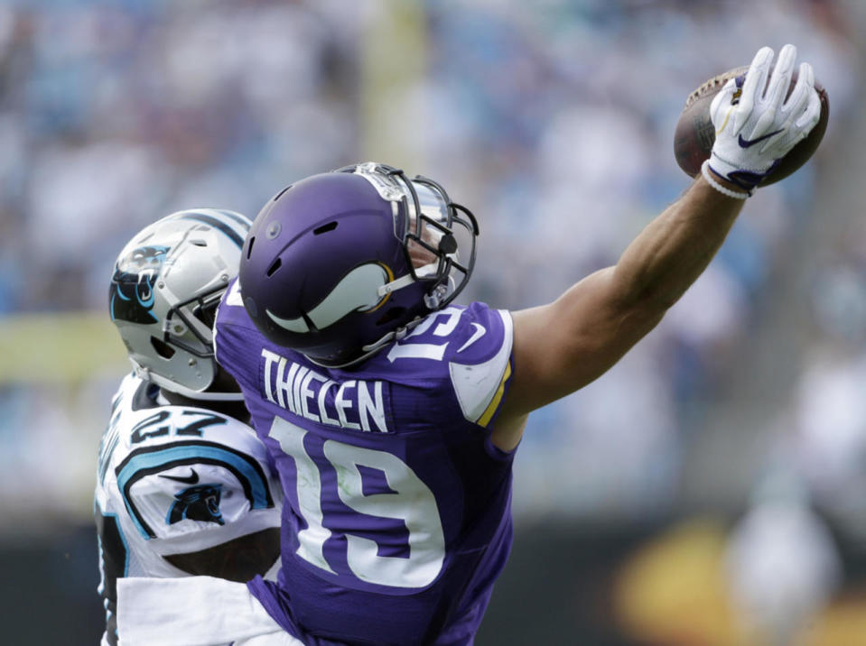 <p>Minnesota Vikings’ Adam Thielen (19) catches a pass as Carolina Panthers’ Robert McClain (27) defends in the second half of an NFL football game in Charlotte, N.C., Sept. 25, 2016. (Photo: Bob Leverone/AP)</p>