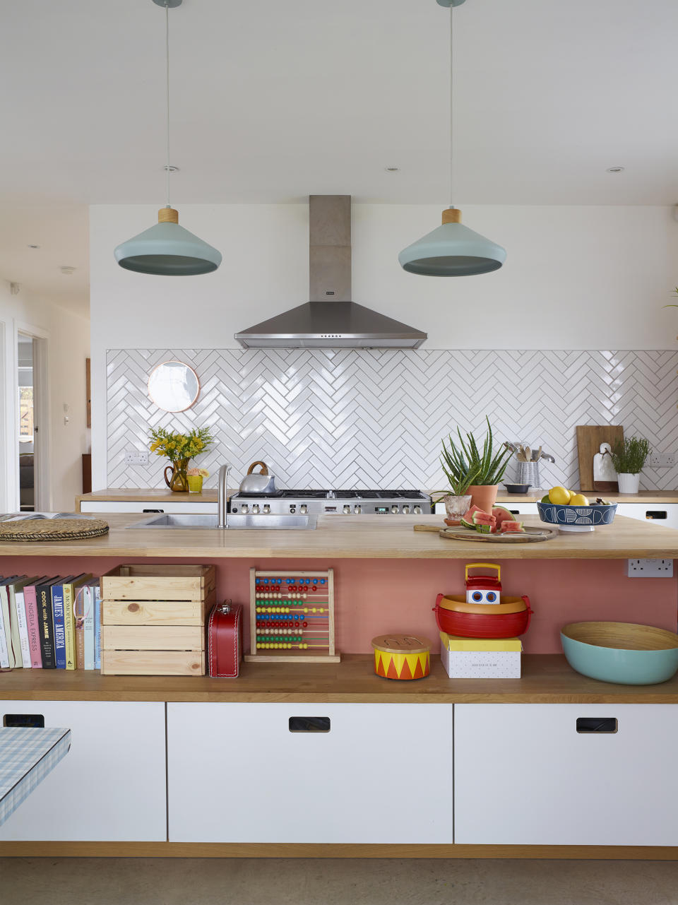 <p> Homeowner Rhiannon Payne used her kitchen island as an opportunity to introduce color to an otherwise neutral kitchen &#x2013; and pairing the splash of pink with the natural tones and texture of plywood makes for a subtle take on a bolder scheme. </p>