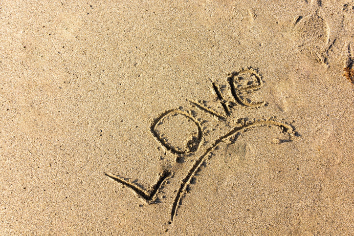 "Love" written in the sand