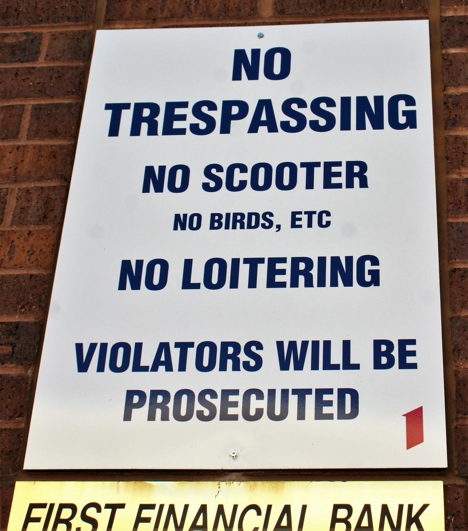 A sign above the entrance to the First Financial Bank parking garage warns scooter drivers not ride up and down ramps. June 24 20202