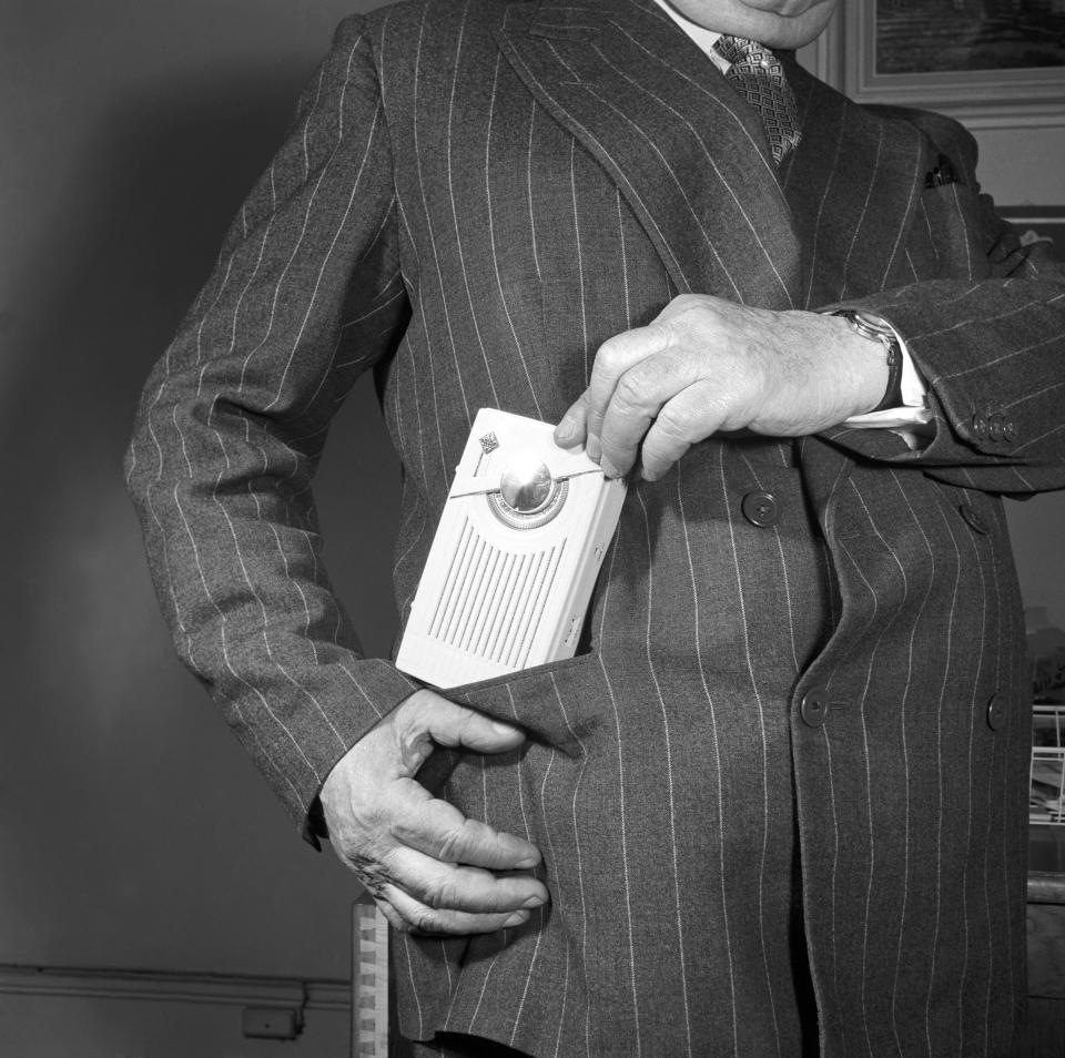 An online photo archive documenting the history of household gadgets was launched with the help of Time Team presenter Tony Robinson. This picture shows an early version of a entertainment system. 'Portable' entertainment began long before most people imagine - the portable transistor radio pictured is from 1954. Robinson says, "The transistor radio was the most popular communications device in history. It was small, battery operated and allowed music to be at the centre of our lives.  I remember getting my first portable radio as a present from my mum and dad after I passed my 11-Plus.  I say portable, but it had a massive battery the size of a small baby. Yet I could just about lug it about from room to room." (Image: Mirrorpix)