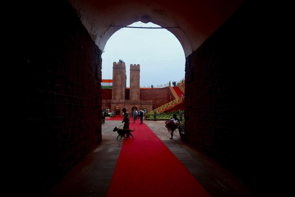 A sniffer dog inspects the area before the start of the Independence Day ceremony on the ramparts of the landmark Red fort monument in New Delhi, India, Saturday, Aug. 15, 2020. (AP Photo/Manish Swarup)