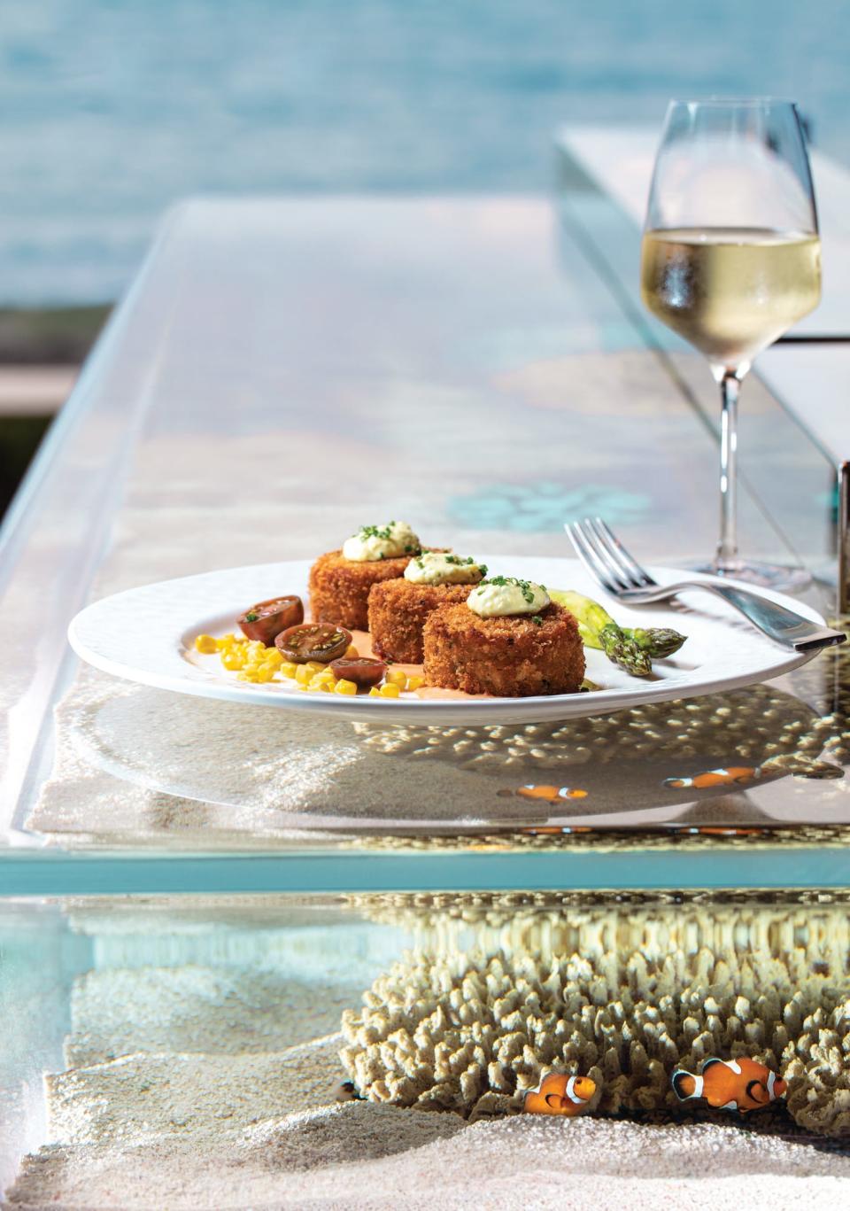 The crab cakes at The Seafood Bar at The Breakers have been buzzed about for years.