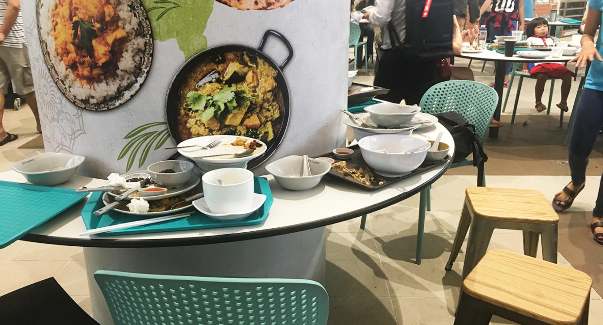 Trays and crockery cluttering tables during a recent visit. (Photo: Gabriel Choo / Yahoo Lifestyle Singapore)