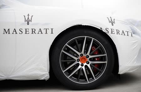 The Maserati logo is pictured on a covered vehicle at the Maserati car plant in Grugliasco, near Turin in this May 22, 2014 file photo. REUTERS/Giorgio Perottino/Files