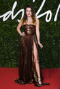 Bella Thorne rocked a daring split in her bronze, cut-away gown [Photo: Getty]