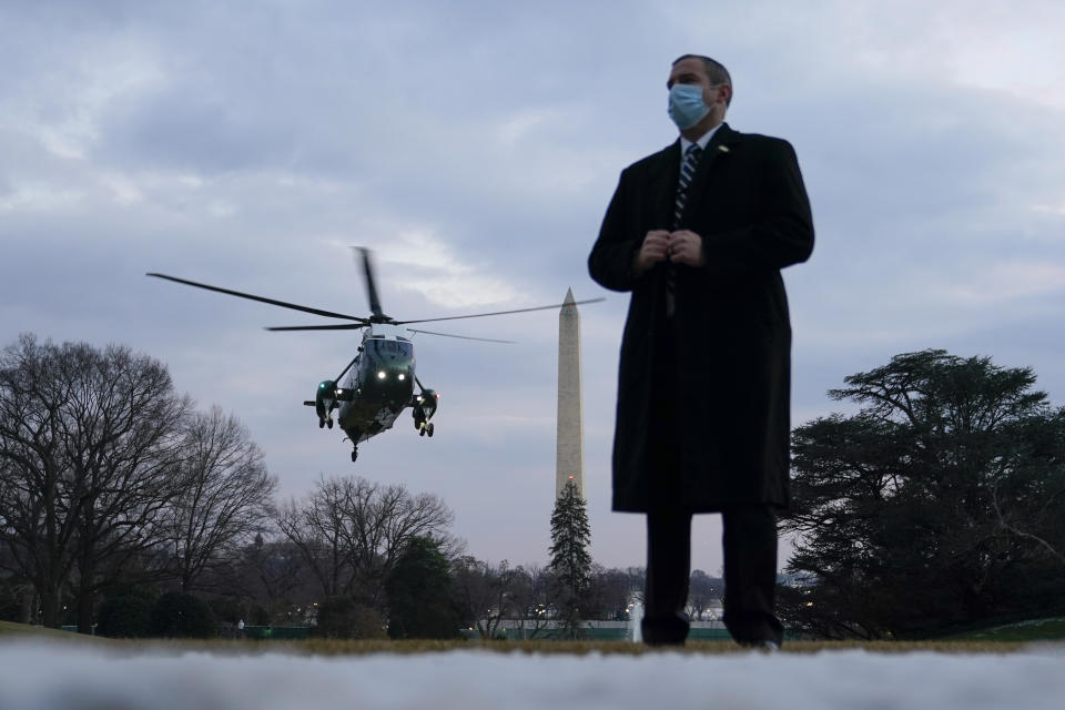 Marine One, with President Joe Biden aboard, approaches the South Lawn of the White House, Friday, Feb. 19, 2021, in Washington. Biden is returning to Washington after visiting Pfizer's COVID-19 vaccine manufacturing site near Kalamazoo, Mich. (AP Photo/Patrick Semansky)